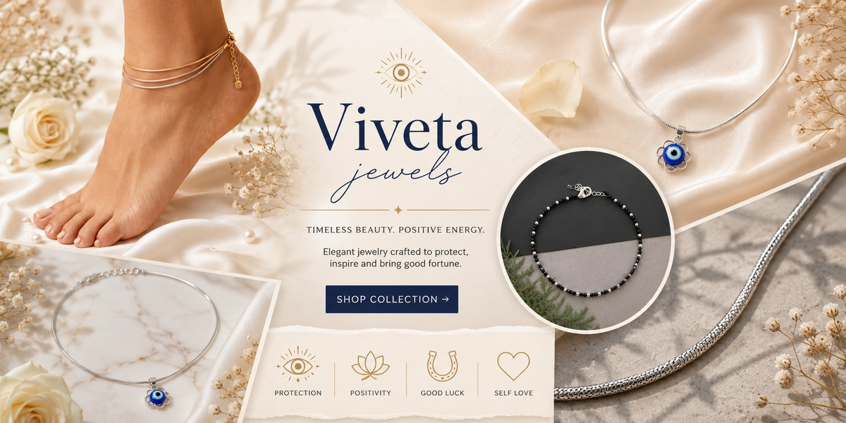 Viveta Jewels advertisement with jewelry on a marble surface and foot wearing a gold anklet.